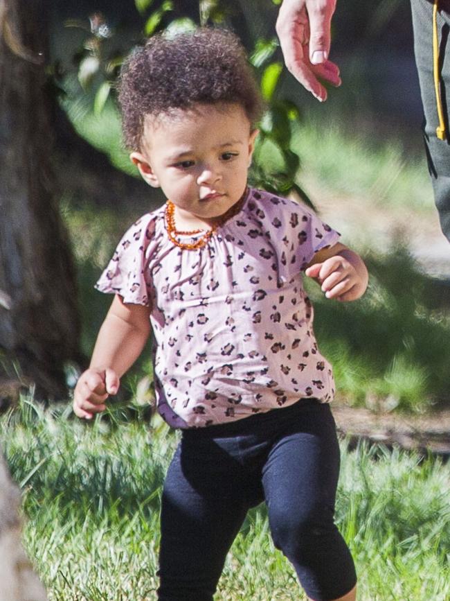 Serena Williams and her husband Alexis Ohanian enjoy an afternoon walk with their 1-year-old daughter Alexia Olympia. Serena's daughter looked seriously cute, toddling her way down the footpath, wearing Nike sneakers like her Mummy. Picture: MediaMode