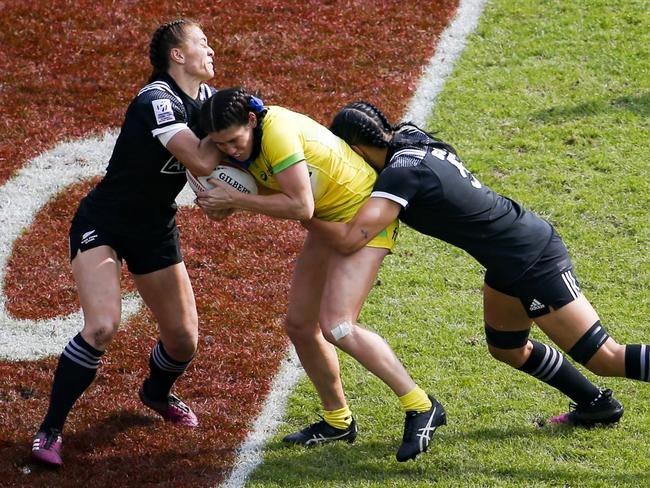 Charlotte Caslick is well held by the Kiwis in the Paris final. Picture: AFP