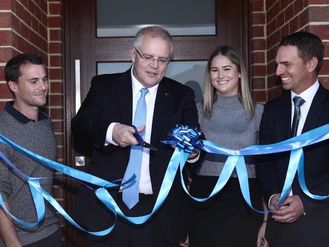 Prime Minister Scott Morrison is going up against six others vying for the seat of Cook. He is pictured with Federal Liberal candidate for Indi Steve Martin (right) as they visit first homeowners Andy and Caitlin. Picture: Dominic Lorrimer