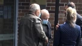 Tadeusz Kijek (second from left) outside court.