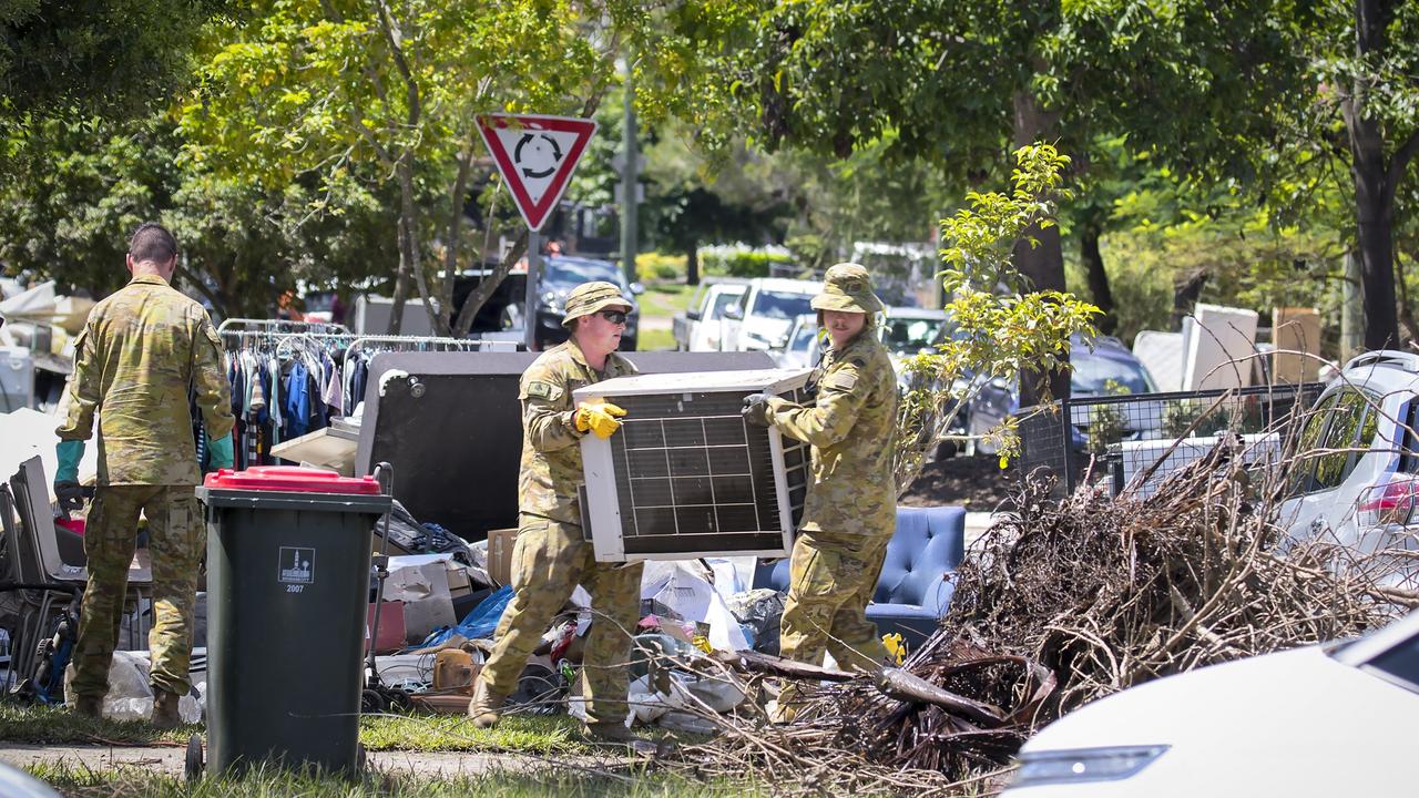 Australian Army soldiers from 2nd/14th Light Horse Regiment (Queensland Mounted Infantry) assist the local community of Gatton, Queensland with removing flood-damaged belongings, as part of Operation Flood Assist 2022.