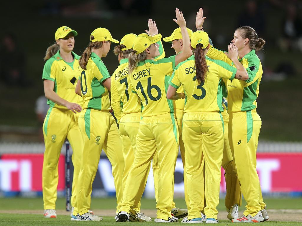 Australian players celebrate the wicket of Hayley Jensen.