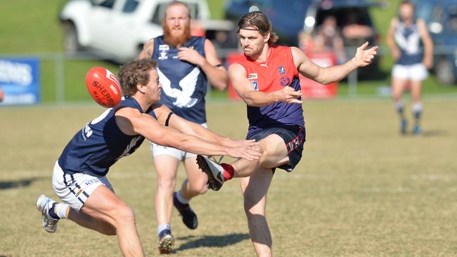 Mt Eliza’s Ben Landry gets his kick away against Edi-Asp on Saturday. Picture: Chris Eastman