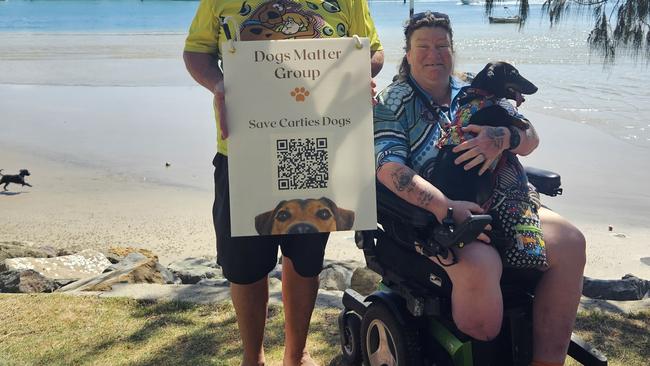 Shane Roberts and Michelle Roberts (right) at the off-leash dog access area at Point Cartwright. Picture: Supplied