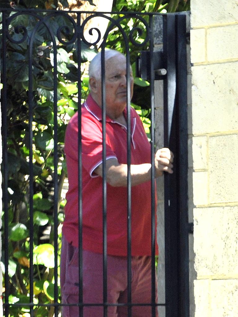 Alan Bond seeing someone off at the front gate of his home in Cottesloe, Western Australia in 2012. Picture: News Corp Australia