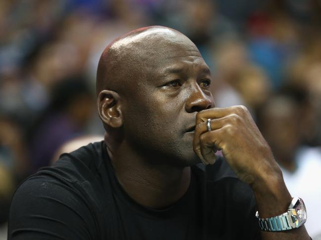 CHARLOTTE, NC - NOVEMBER 01:  Owner of the Charlotte Hornets, Michael Jordan, watches on during their game against the Atlanta Hawks at Time Warner Cable Arena on November 1, 2015 in Charlotte, North Carolina. NOTE TO USER: User expressly acknowledges and agrees that, by downloading and or using this photograph, User is consenting to the terms and conditions of the Getty Images License Agreement.  (Photo by Streeter Lecka/Getty Images)