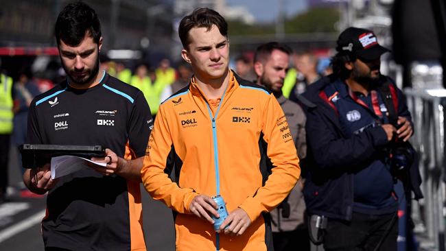 McLaren’s Australian driver Oscar Piastri, centre, walks down pit lane ahead of the Formula One Australian Grand Prix at the Albert Park Circuit in Melbourne. Picture: AFP