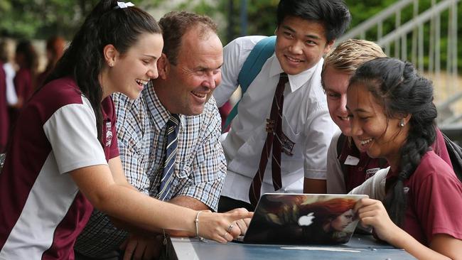 Beenleigh State High School principal Matt O’Hanlon talks to students. Year 9 students scored higher than most other similar schools in spelling.