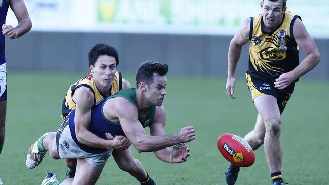 Ben Moloney gets a handball away in the last GFL grand final. Picture: Alan Barber