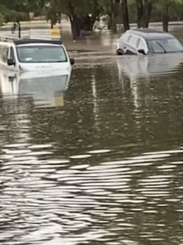 Cars were submerged after flash floods in Clarkson, Perth. (Facebook: Ashyy Grostate)