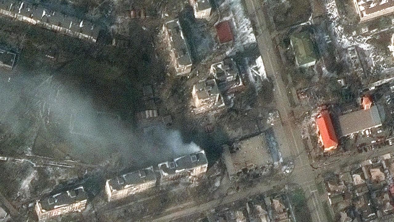 This Maxar satellite image taken and released on March 12 shows burning apartment buildings in western Mariupol, which has been particularly hard hit. Picture: AFP Photo/Satellite image ©2022 Maxar Technologies