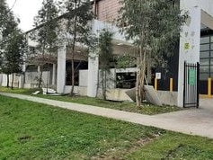 Damaged fence panels near the loading dock and staff car park at the Glenrose Shopping Village. Picture: David Buchanan