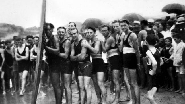 Duke Kahanamoku hamming it up with bathers in Australia in 1915. Picture: Supplied