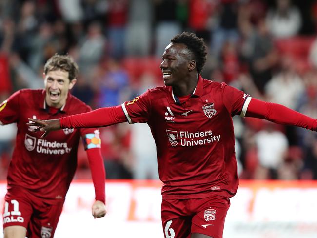 Nestory Irankunda celebrates scoring for Adelaide United. Picture: Sarah Reed/Getty Images