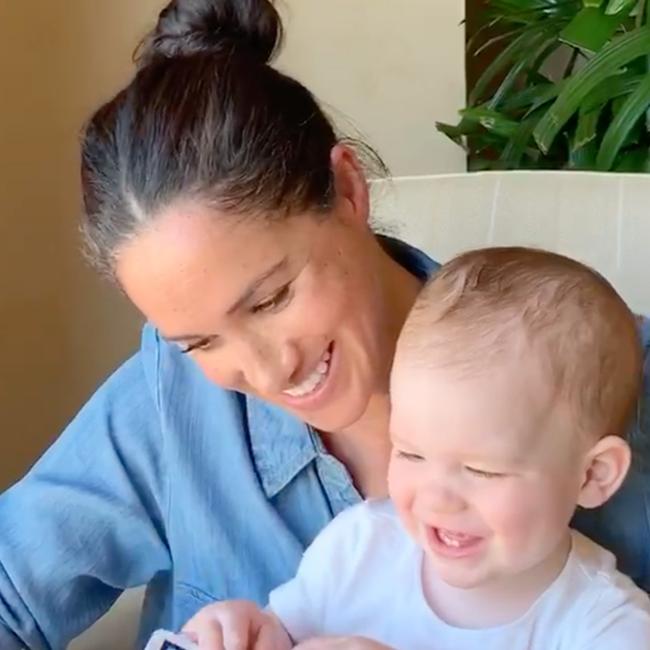 Meghan reading a picture book to Archie on his birthday in May. Picture: Getty Images.