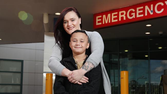 Pictured outside Campbelltown Hospital is Kathleen Warren with her son Cohen Leota-lu (8). Cohen was transferred to Randwick Hospital for surgery, meaning Kathleen had to commute to Sydney. Picture: Richard Dobson