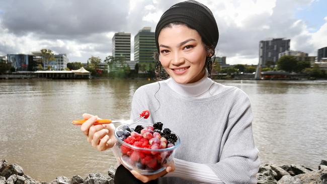 Brisbane’s Razia Khalili with bowl of berries, which are one of the best foods for relieving stress in women. Steve Pohlner