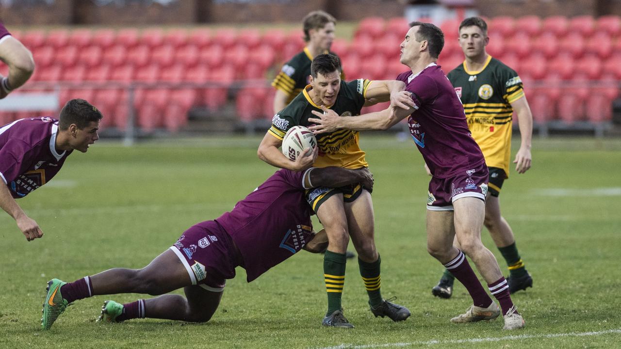 Dalby players Tomasi Naborisi (left) and Harrison Skinner tackle Joshua Henry of Wattles. Picture: Kevin Farmer.