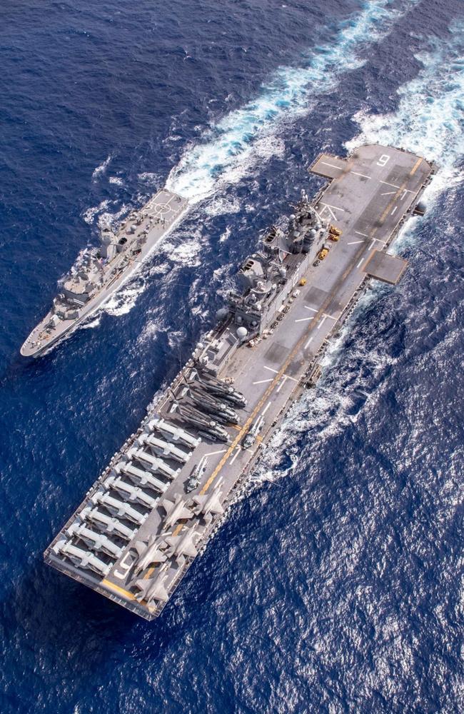 The forward-deployed amphibious assault ship USS America (LHA 6) conducts a fuelling-at-sea with the Royal Australian Navy frigate HMAS Ballarat (FFH 155) in support of flight deck operations during Exercise Talisman Sabre. Picture: Mass Communication Specialist 3rd Class Matthew Cavenaile/US Navy