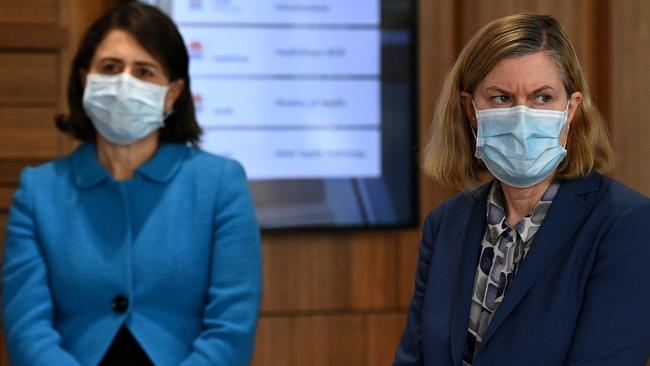 Premier Gladys Berejiklian and chief health officer Kerry Chant just before announcing on Thursday that NSW had recorded 1029 new cases of Covid. Picture: Getty
