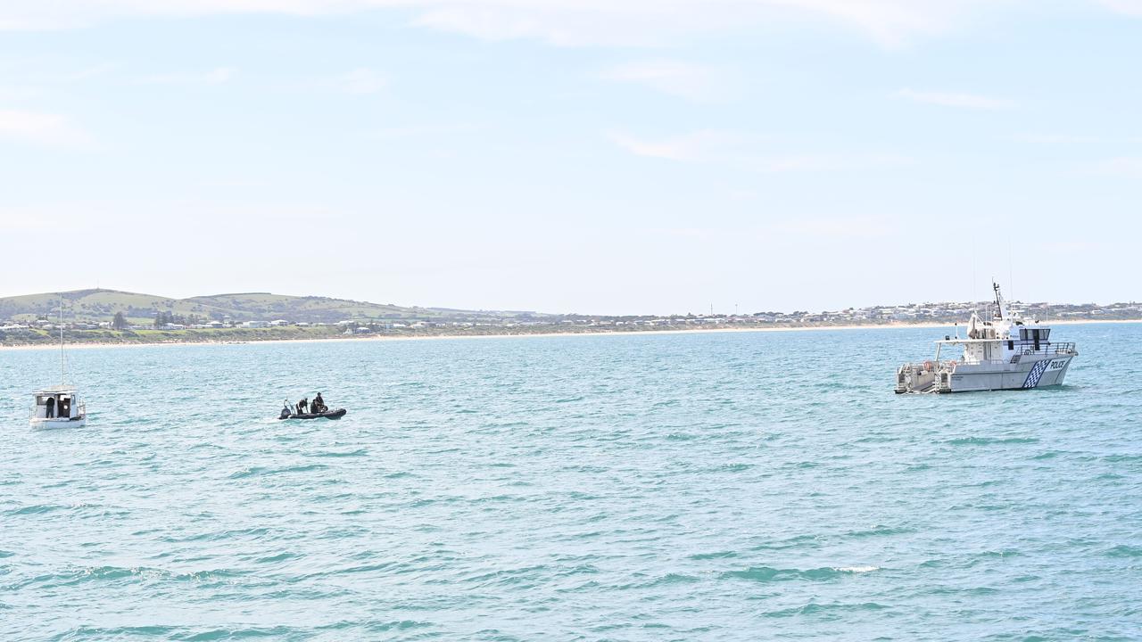 Police towed Derek Robinson and Tony Higgins’ boat to Granite Island. Picture: Keryn Stevens