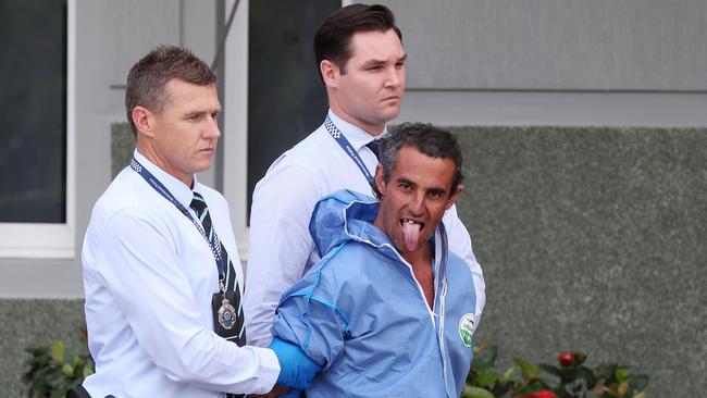 Police escort accused murderer Paul Conoley to the watch-house. Picture: Tara Croser.