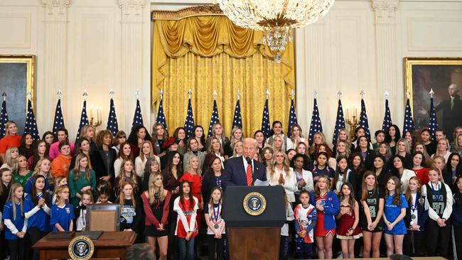 Donald Trump with campaigners against transgender women in sport. Picture: AFP.