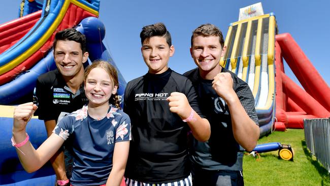 Supercar drivers Nick Percat and Todd Hazelwood with kids Ruby (8) and Tom (12) on The Big Wedgie, which will be located in the Family Zone at the Superloop Adelaide 500 this year. Picture: AAP/Sam Wundke