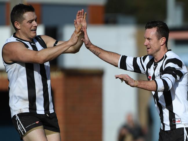 Matt Krawczyk (right) celebrates a goal during last year’s finals series. Picture: James Ross/AAP