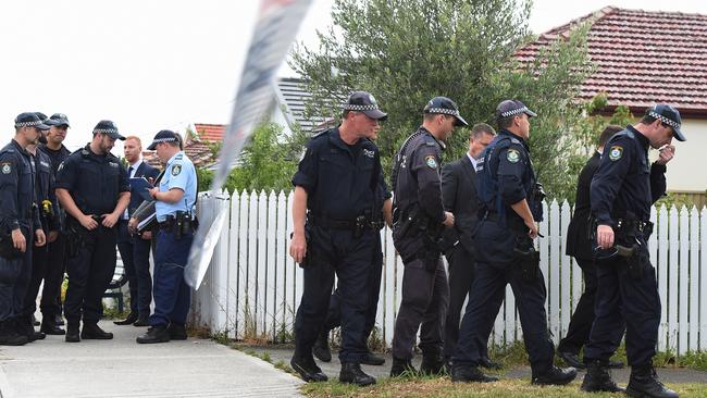 Police from the NSW Public Order and Riot squad comb murder scene today. Picture: AAP