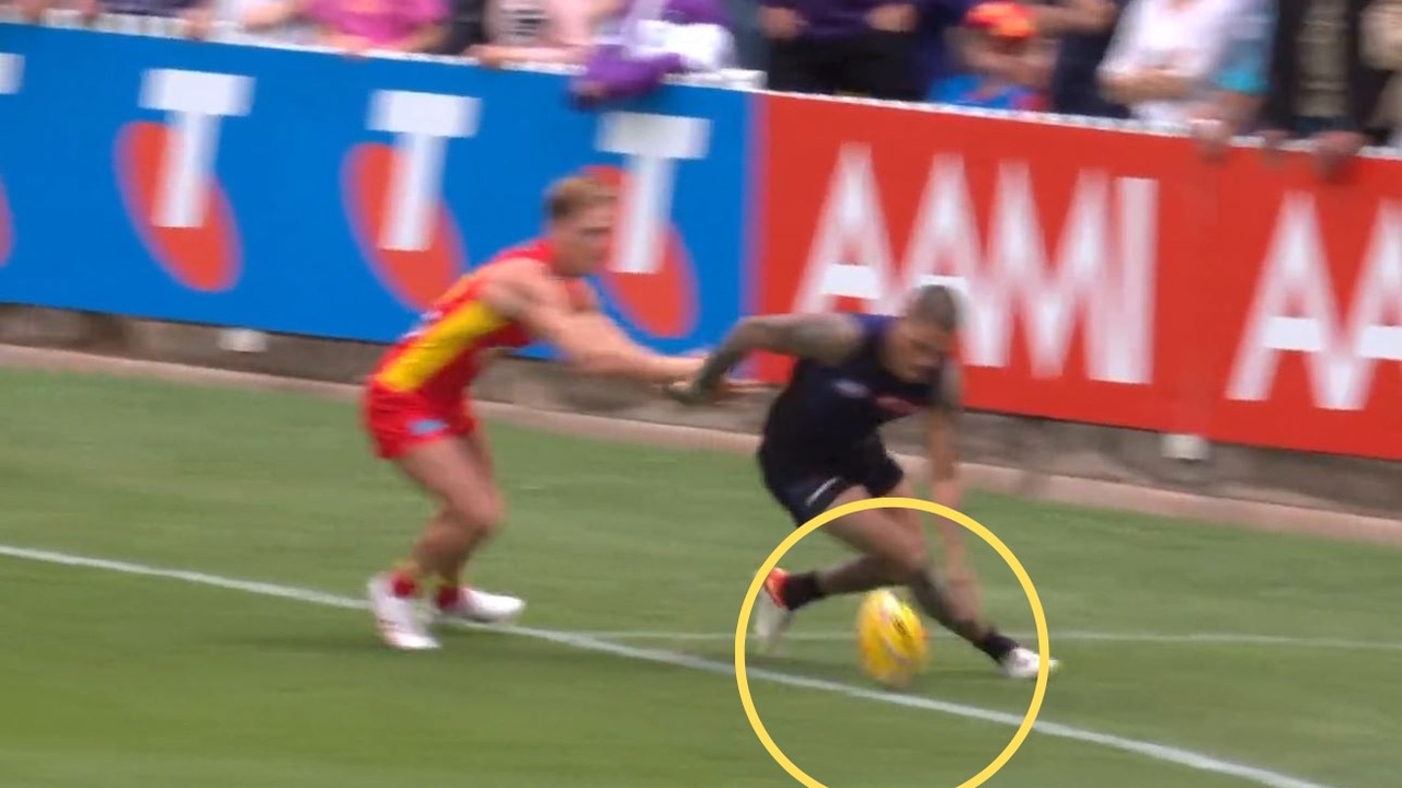 Michael Walters chases a ball out of bounds during Gather Round 2023 against the Gold Coast Suns.