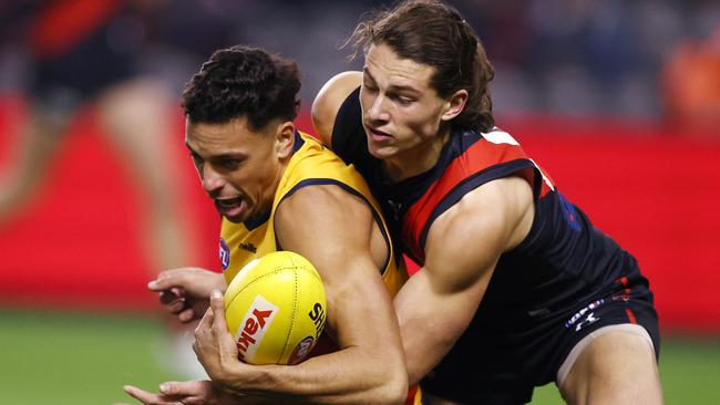 Archie Perkins tackles Ben Davis during a big night for the young Bomber. Picture: Michael Klein