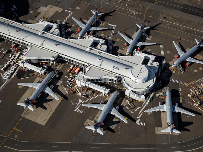 SYDNEY, AUSTRALIA - APRIL 22: Jetstar planes are grounded at Sydney Domestic Airport on April 22, 2020 in Sydney, Australia. Restrictions have been placed on all non-essential business and strict social distancing rules are in place across Australia in response to the COVID-19 pandemic.  (Photo by Cameron Spencer/Getty Images)