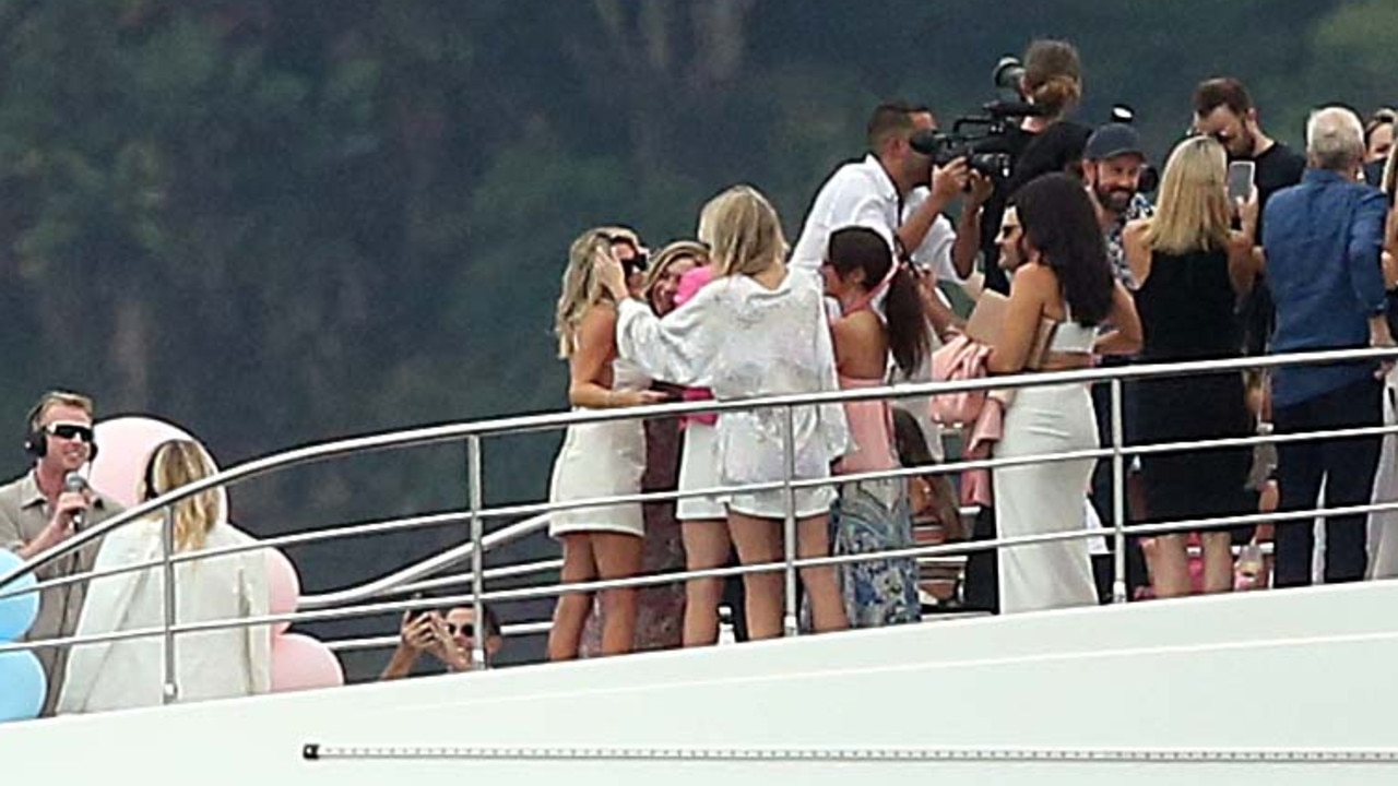 An excited crowd gathered around the couple to celebrate the news. Picture: Matrix Media Group