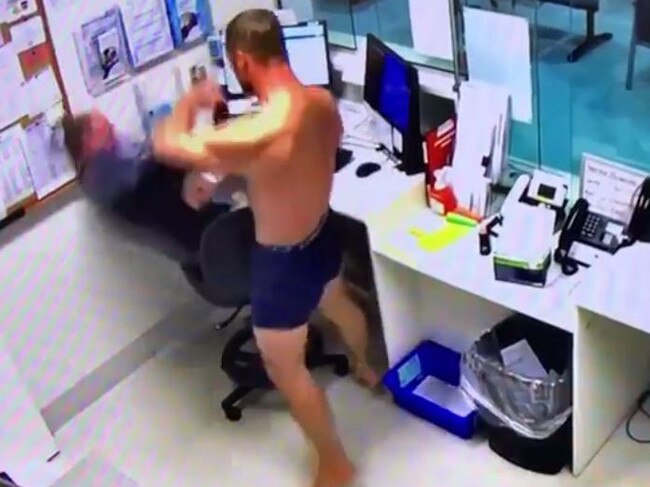 The footage shows a man swinging at the healthcare worker.