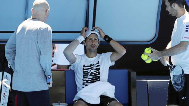 Novak Djokovic with coaches Andre Agassi (left) and Radek Stepanek in Melbourne. Picture: MARK CRISTINO