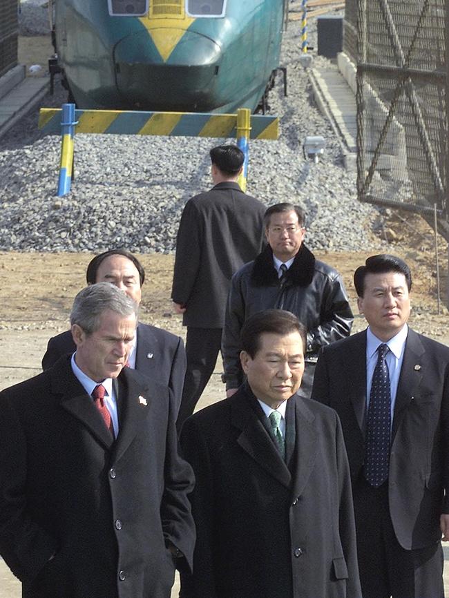 Then-US President George W. Bush (L) inside the Demilitarized Zone (DMZ) in 2003. Picture: AFP