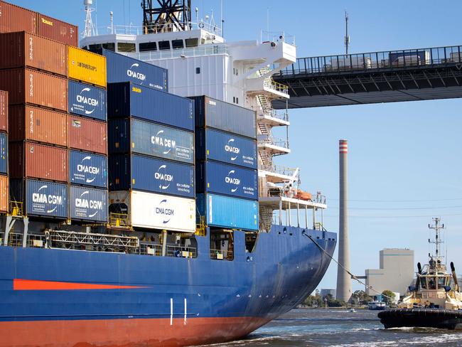 MELBOURNE, DECEMBER 9, 2022: Tour of AustraliaÃs largest container and general cargo port, the Port of Melbourne. A Svitzer tug boat follows a container ship under the West Gate Bridge. Picture: Mark Stewart