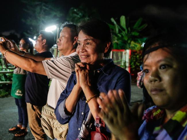 Onlookers watch and cheer as ambulances deliver the boys rescued from the cave to hospital in Chiang rai. Picture: Lauren DeCicca/Getty Images