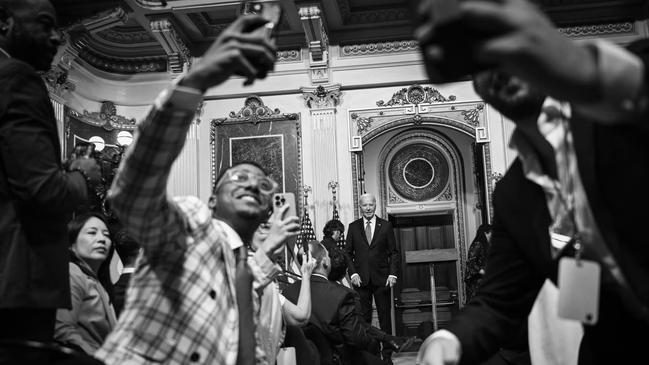 Audience members take photos after Biden spoke at the White House Creator Economy Conference in August. Photo: Brendan Smialowski/AFP/Getty Images