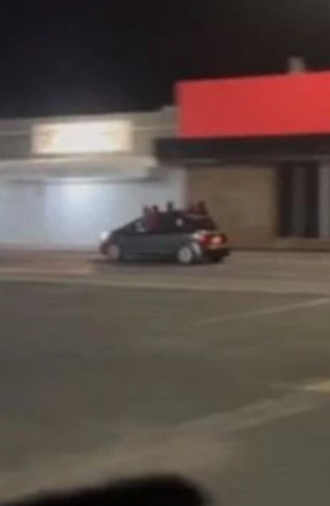 The exclusive vision obtained by Sky News shows multiple youths hanging out of cars, while driving around Alice Springs. Picture: Sky New Australia