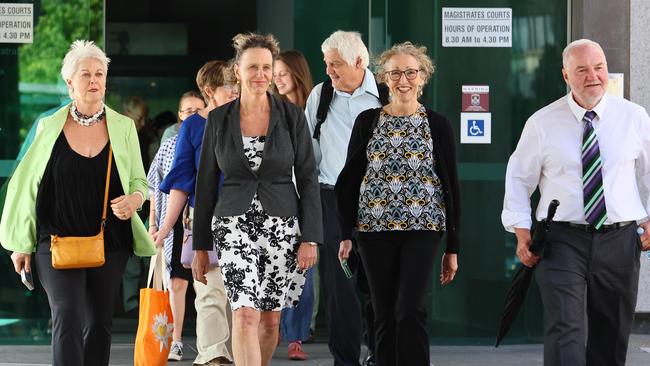 Extinction Rebellion State Parliament protesters leave the Brisbane Magistrates court after they were sentenced. Picture: Tertius Pickard