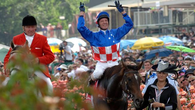 Makybe Diva with Glen Boss after a record third Melbourne Cup win.