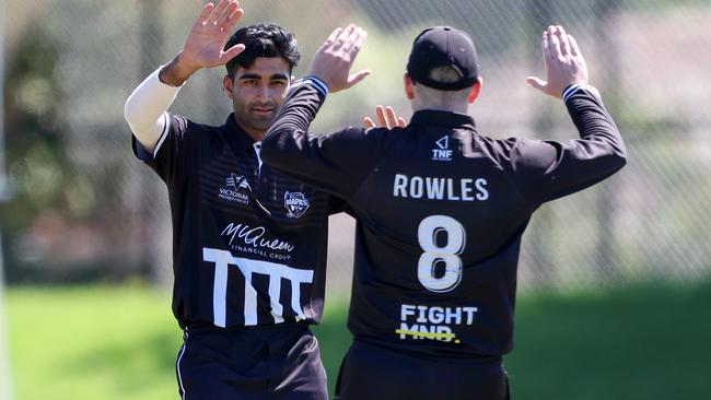 Shubham Bhargave of the Camberwell Magpies celebrates a wicket with Ben Rowles. Picture: Georg Sal