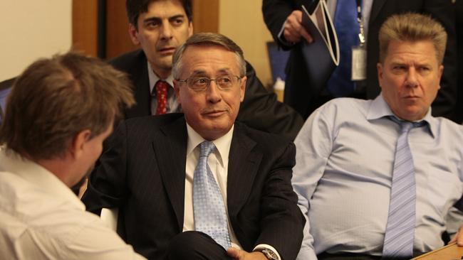 Wayne Swan speaks with journalists, including Chris Mitchell, in the 2009 lock-up.