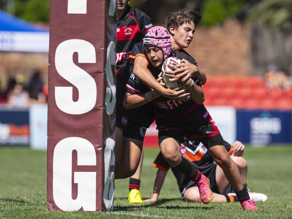 Hunter Collins of Valleys is tackled by Harrison Parsons of Southern Suburbs in U13/14 boys Toowoomba Junior Rugby League grand final at Toowoomba Sports Ground, Saturday, September 7, 2024. Picture: Kevin Farmer