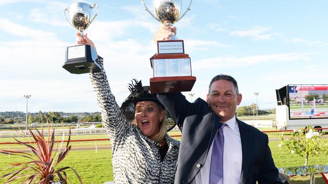 Trainer Tony Sears and his wife Leigh show off the spoils of Choice Bro’s win in the Weetwood Handicap at Toowoomba on Saturday. Picture: Grant Peters