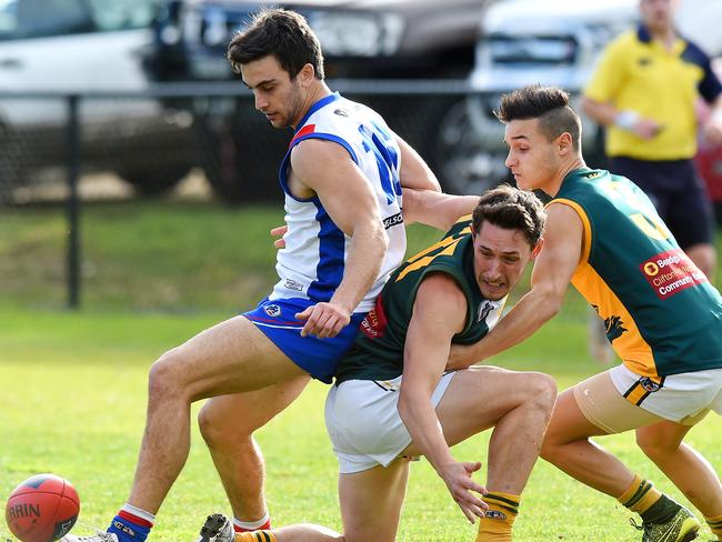 NFL footy: West Preston-Lakeside V Northcote Park. (L-R) West Preston-Lakesine's Nathan Valladares and Northcote Park's Justin Chilcott and Daniel Costanzo. Picture: Josie Hayden