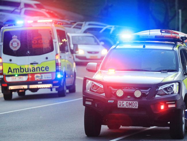 March 13, Rainbow Bay, Coolangatta, Gold Coast - Queensland Ambulance Officers interview witnesses to a mistaken report of a shark attack which turned out to be a self inflicted Surfing Fin Chop.Picture Scott Powick Newscorp