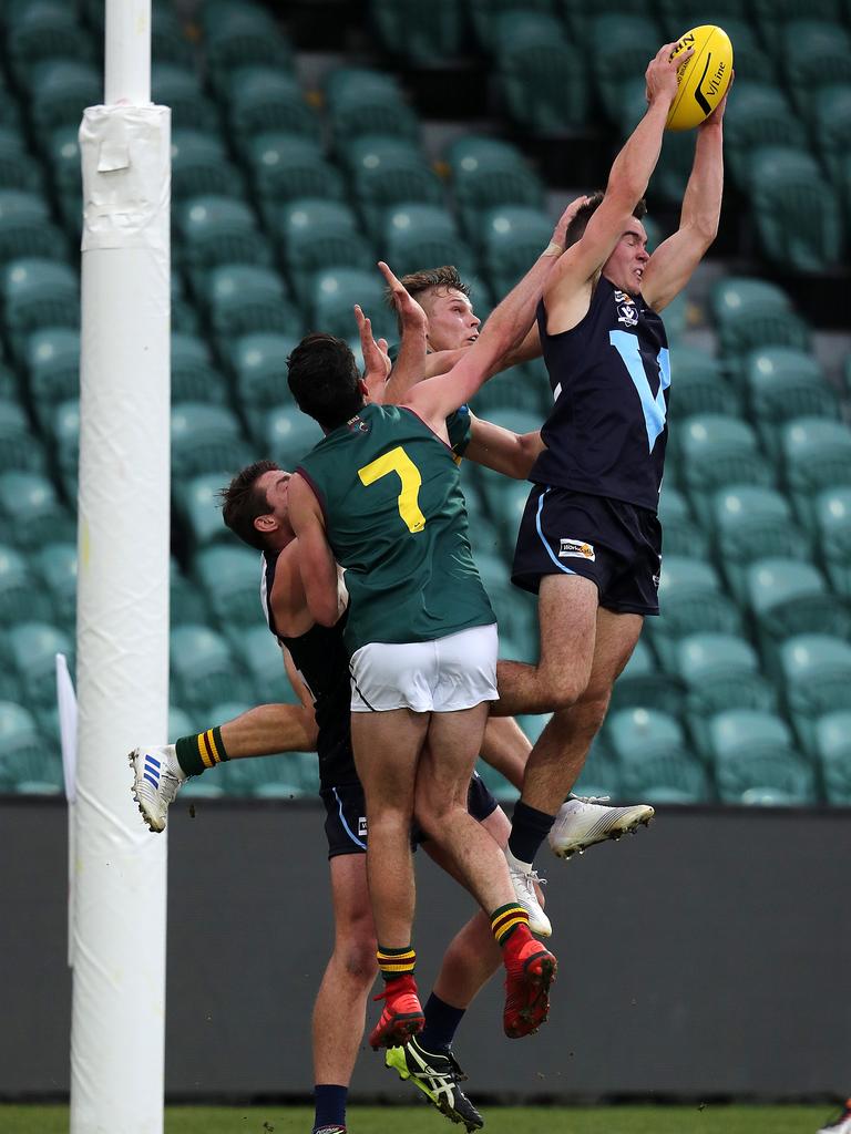 Vic Metro Jake Hobbs marks during the game against Tasmania at UTAS Stadium. PICTURE CHRIS KIDD